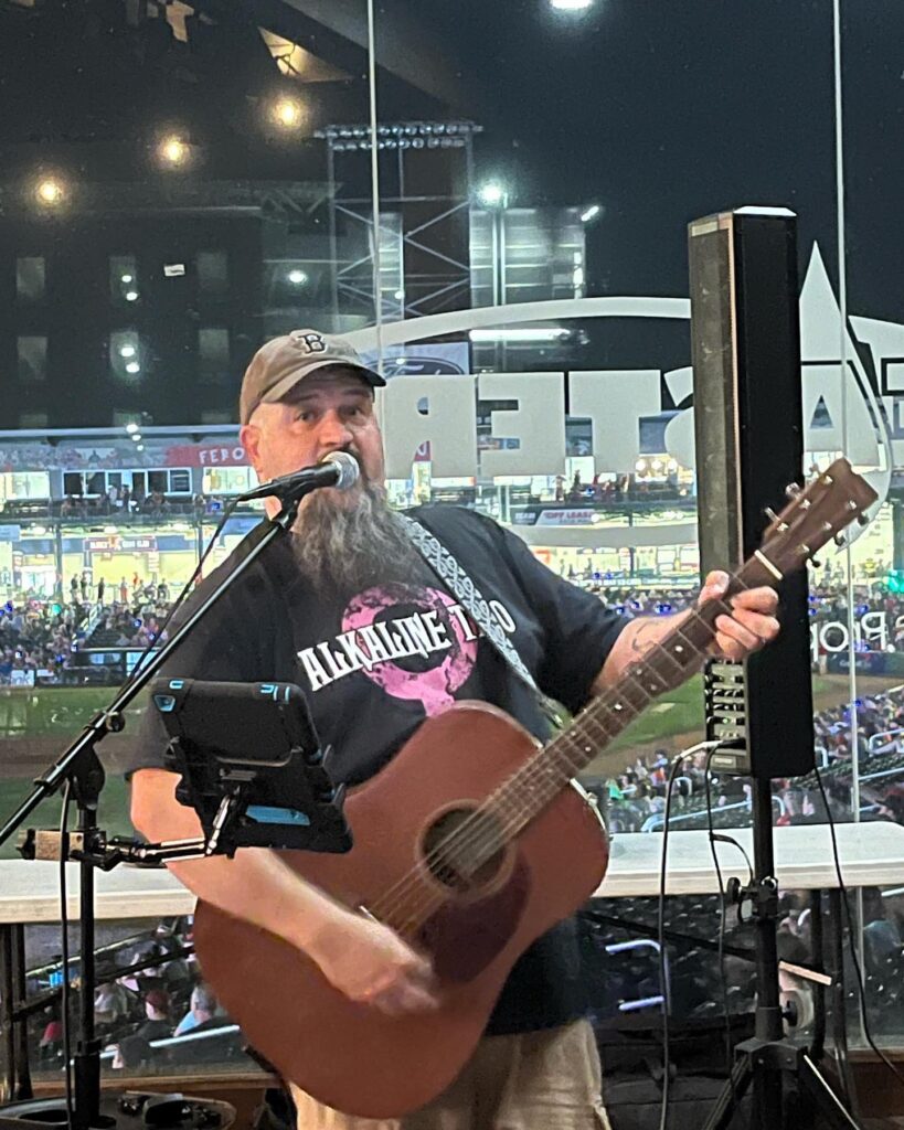 Tim Hazelton performing live at Delta Dental Stadium during a New Hampshire Fisher Cats game.